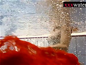 jaw-dropping red-hot damsel swimming in the pool