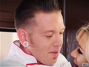 Jessica gets a cute plumb by her Chef in the kitchen